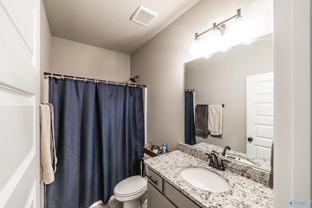 bathroom with a shower with curtain, vanity, and toilet