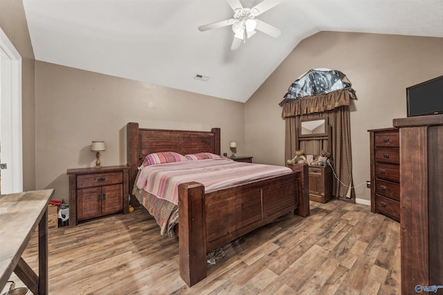 20729 Colonial Dr, Athens, AL 35614 - bedroom with vaulted ceiling, light wood-style floors, and ceiling fan