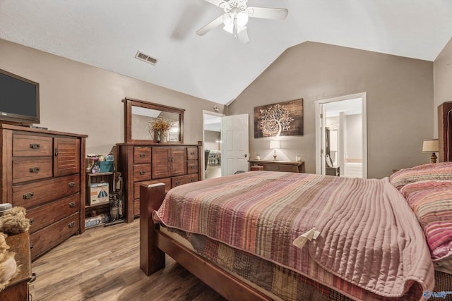 20729 Colonial Dr, Athens, AL 35614 - bedroom with light wood-type flooring, lofted ceiling, ceiling fan, and connected bathroom