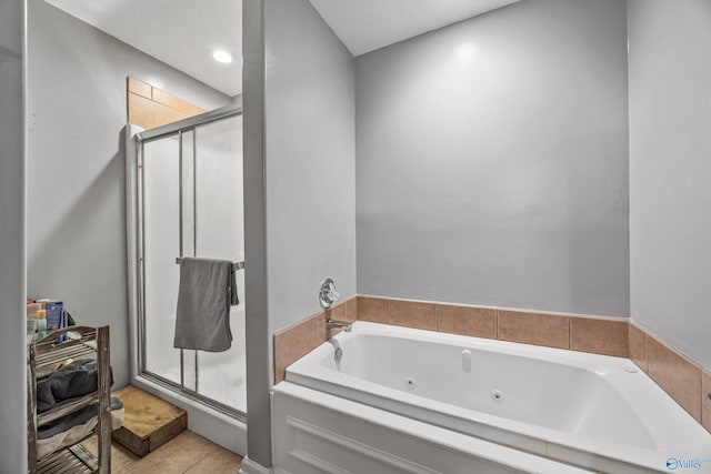 20729 Colonial Dr, Athens, AL 35614 - bathroom with a shower stall, a jetted tub, and tile patterned flooring