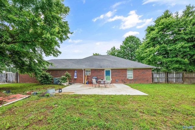 20729 Colonial Dr, Athens, AL 35614 - back of property featuring brick siding and a patio