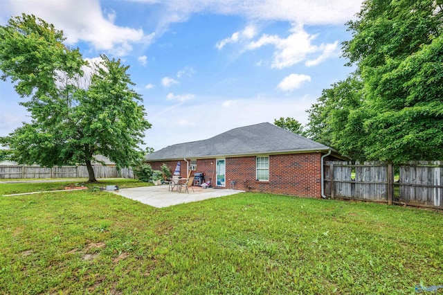 20729 Colonial Dr, Athens, AL 35614 - rear view of property featuring brick siding and a patio area