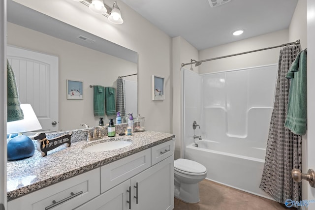 full bathroom featuring vanity, tile patterned flooring, toilet, and shower / bath combo with shower curtain