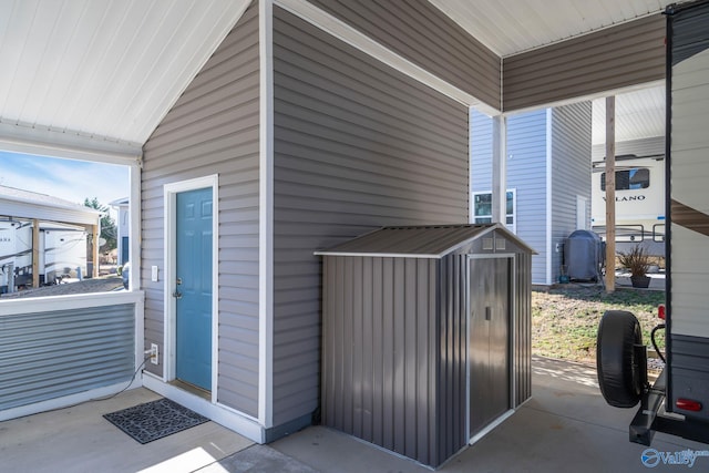 view of patio / terrace featuring a shed