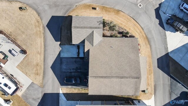 view of front facade with a front yard and a carport