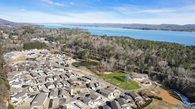 drone / aerial view featuring a water view and a residential view