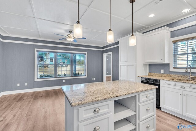 dining space featuring light wood-type flooring and ceiling fan