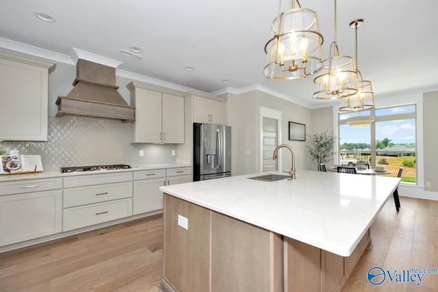 217 Idle Creek Dr, Huntsville, AL 35811 - kitchen with stainless steel fridge with ice dispenser, custom exhaust hood, a sink, light wood-style flooring, and gas cooktop