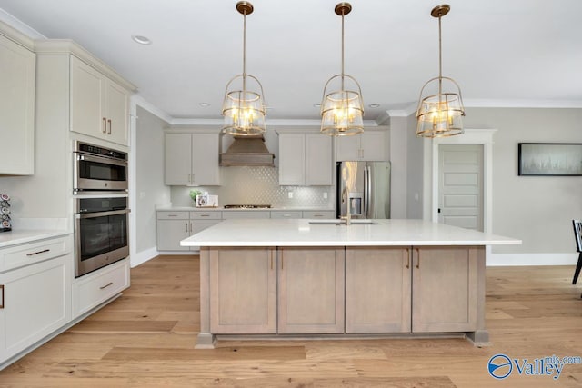 217 Idle Creek Dr, Huntsville, AL 35811 - kitchen featuring crown molding, custom exhaust hood, a sink, stainless steel appliances, and a notable chandelier