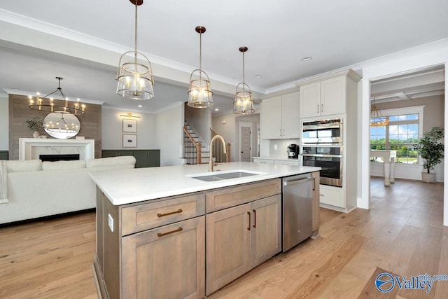 217 Idle Creek Dr, Huntsville, AL 35811 - kitchen featuring a sink, light countertops, an island with sink, and stainless steel appliances