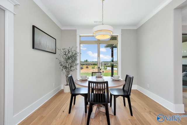 217 Idle Creek Dr, Huntsville, AL 35811 - dining space featuring baseboards, visible vents, light wood-type flooring, and crown molding