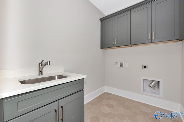 217 Idle Creek Dr, Huntsville, AL 35811 - clothes washing area featuring hookup for a washing machine, hookup for an electric dryer, a sink, baseboards, and cabinet space
