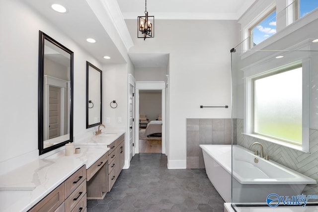 217 Idle Creek Dr, Huntsville, AL 35811 - ensuite bathroom with a wealth of natural light, a freestanding bath, connected bathroom, and vanity