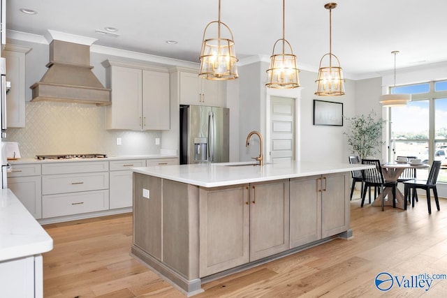 217 Idle Creek Dr, Huntsville, AL 35811 - kitchen featuring stainless steel fridge with ice dispenser, custom exhaust hood, light wood-style floors, and a sink