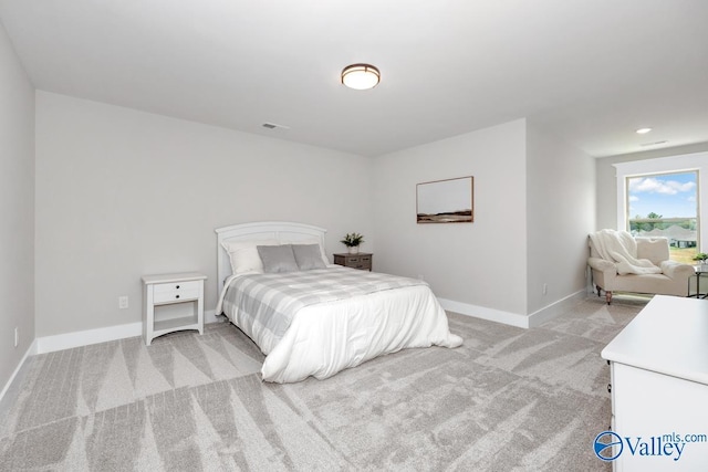 217 Idle Creek Dr, Huntsville, AL 35811 - bedroom with visible vents, baseboards, and light carpet