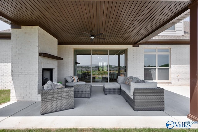 217 Idle Creek Dr, Huntsville, AL 35811 - view of patio / terrace with an outdoor living space with a fireplace and ceiling fan