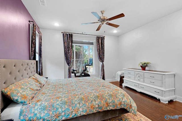 bedroom featuring dark wood-style floors, baseboards, visible vents, and recessed lighting