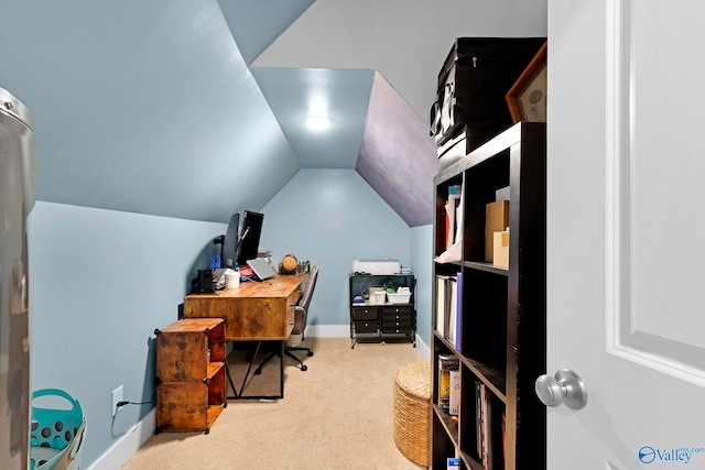 home office with baseboards, vaulted ceiling, and carpet flooring