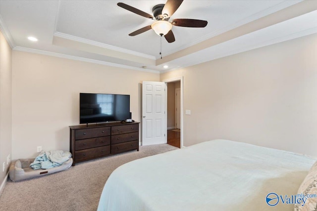 bedroom featuring a raised ceiling, ceiling fan, light colored carpet, and crown molding