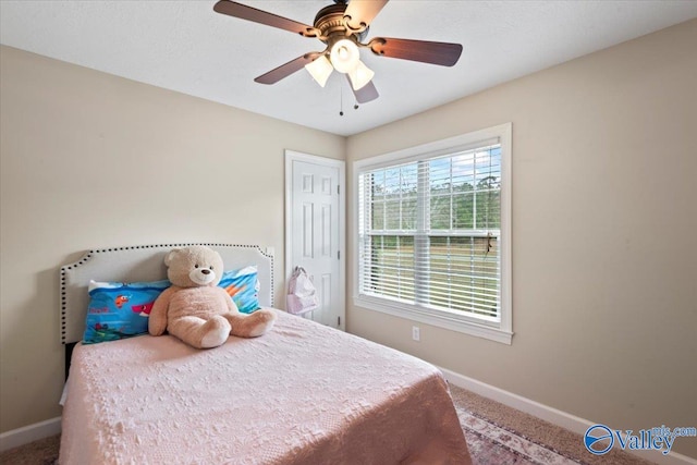 carpeted bedroom featuring ceiling fan