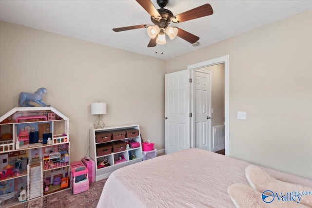 carpeted bedroom featuring ceiling fan