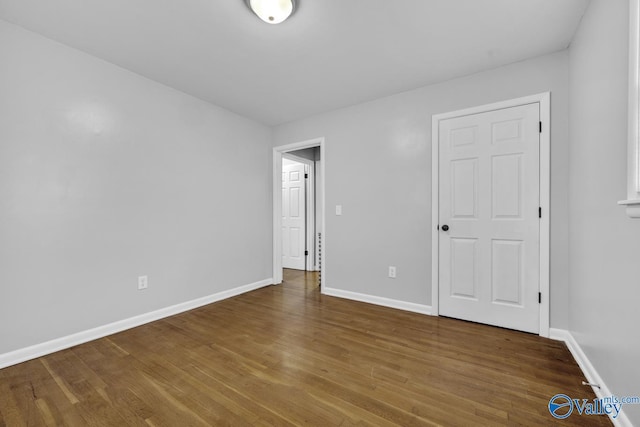 unfurnished bedroom featuring hardwood / wood-style flooring