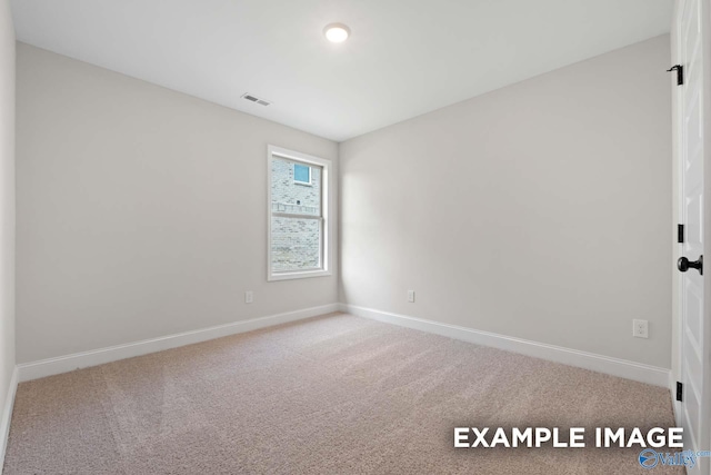 spare room featuring carpet floors