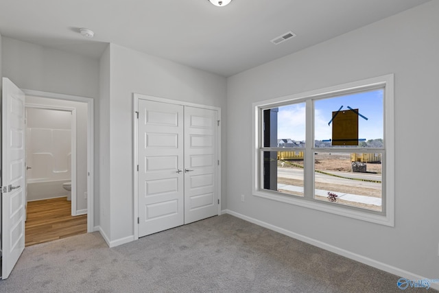 17437 Brooklawn St, Athens, AL 35611 - unfurnished bedroom with carpet floors, a closet, and baseboards