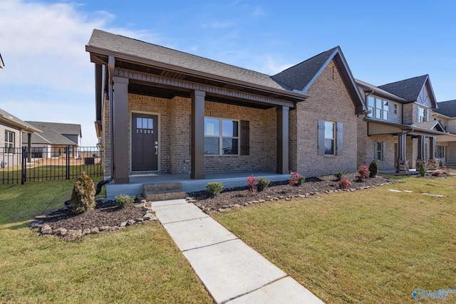 17437 Brooklawn St, Athens, AL 35611 - view of front of property featuring brick siding, a porch, and roof with shingles