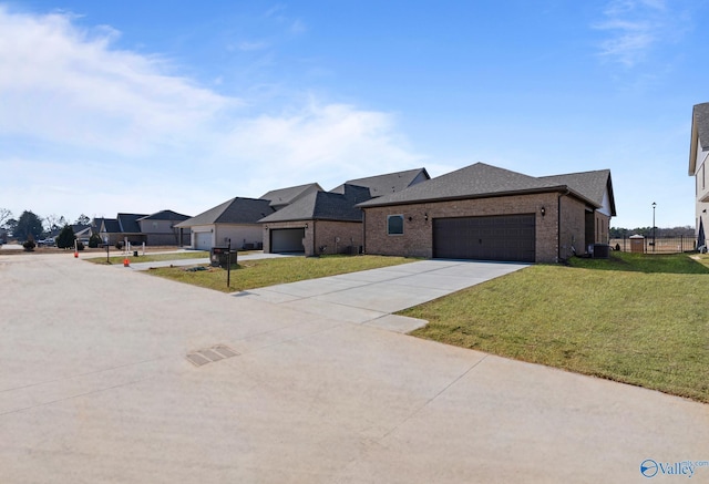17437 Brooklawn St, Athens, AL 35611 - view of front facade featuring a front yard, an attached garage, driveway, and cooling unit