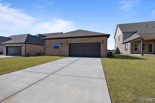17437 Brooklawn St, Athens, AL 35611 - view of front of property featuring an attached garage, a front yard, brick siding, and concrete driveway