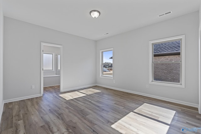 17437 Brooklawn St, Athens, AL 35611 - spare room with healthy amount of natural light, wood finished floors, and baseboards