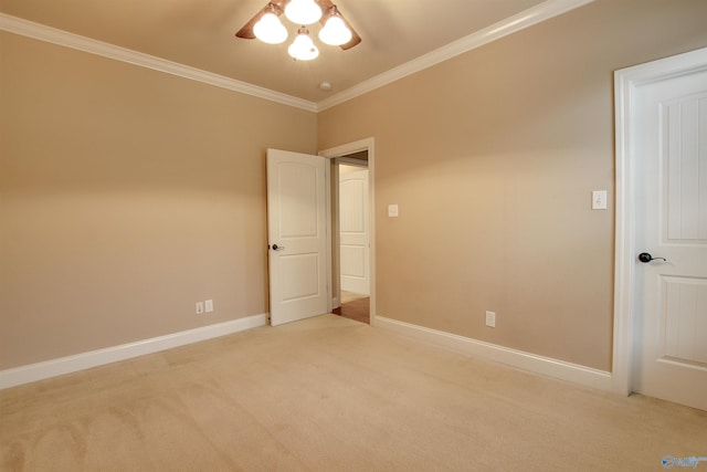 unfurnished bedroom featuring carpet, baseboards, and crown molding