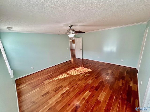 unfurnished room featuring crown molding, ceiling fan, wood-type flooring, and a textured ceiling