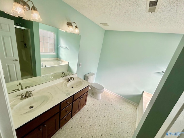 full bathroom with vanity, a textured ceiling, toilet, and independent shower and bath