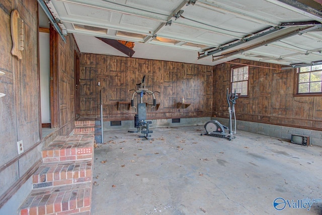 garage featuring wooden walls