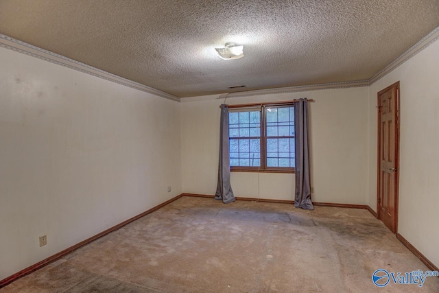 spare room with light carpet, ornamental molding, a textured ceiling, and baseboards