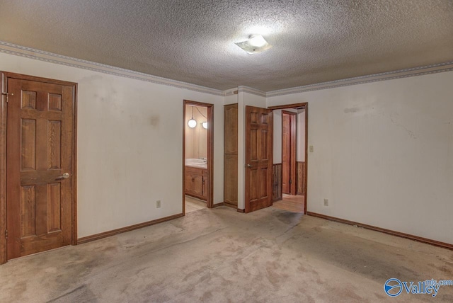 unfurnished bedroom with crown molding, a textured ceiling, and light colored carpet