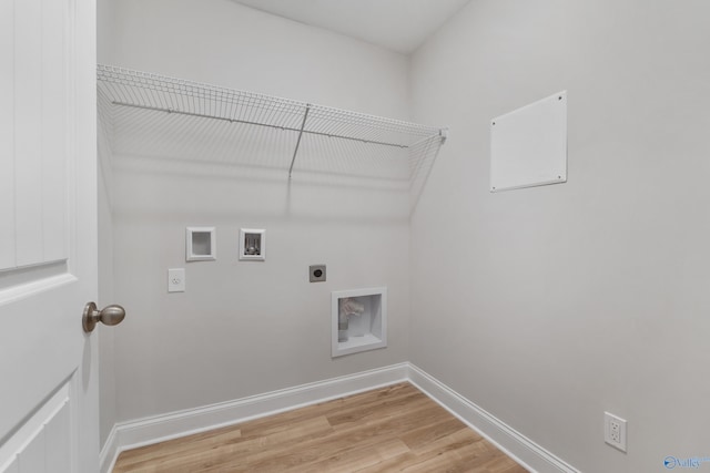 laundry area with hookup for a washing machine, light hardwood / wood-style flooring, and electric dryer hookup