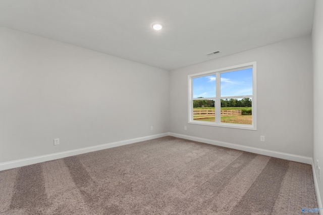 unfurnished room featuring carpet flooring