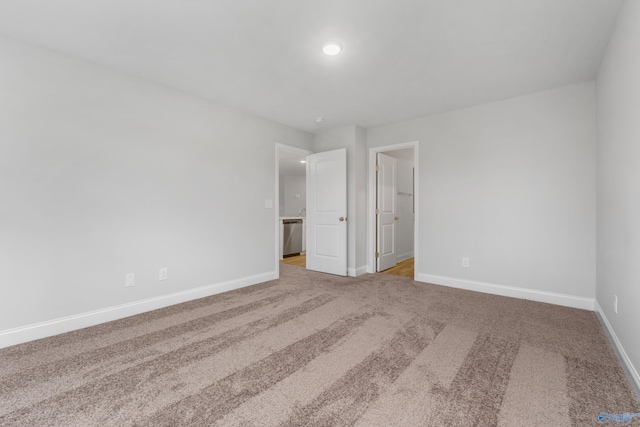 empty room featuring light colored carpet