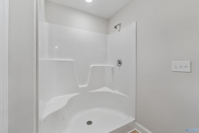 bathroom featuring walk in shower