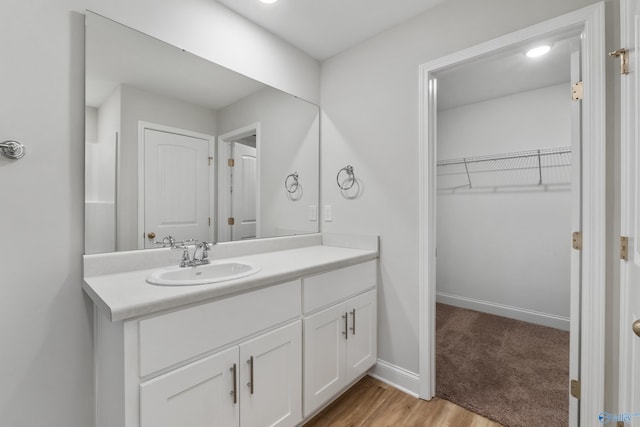 bathroom with wood-type flooring and vanity