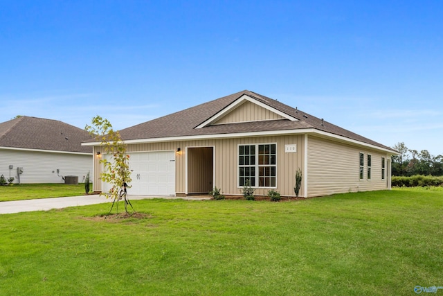 ranch-style home with a garage, a front lawn, and central air condition unit