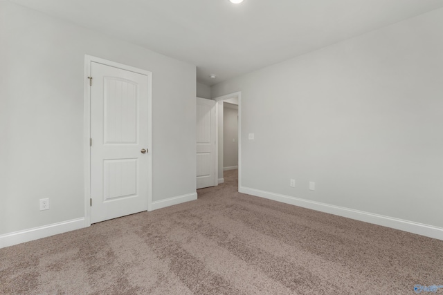 unfurnished bedroom with carpet