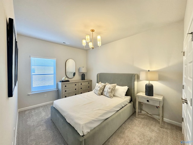 carpeted bedroom featuring a chandelier, visible vents, and baseboards