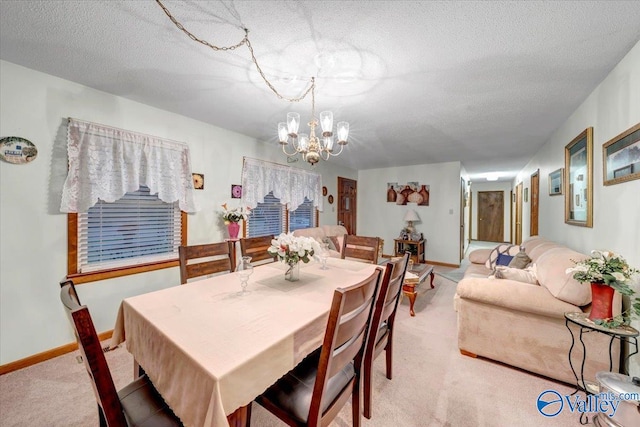 carpeted dining space featuring a textured ceiling and a notable chandelier