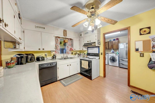 kitchen with stainless steel refrigerator, washer and clothes dryer, white electric stove, white cabinets, and black dishwasher