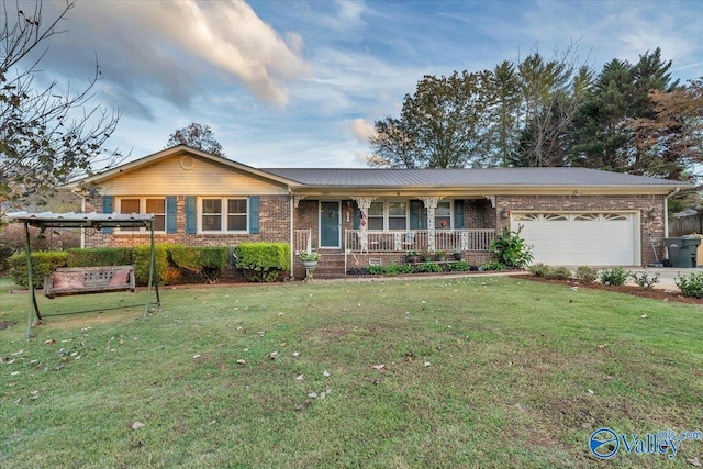 ranch-style house with a front lawn, a garage, and covered porch