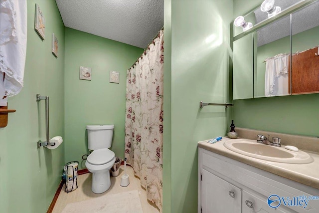 bathroom with toilet, vanity, a textured ceiling, and curtained shower